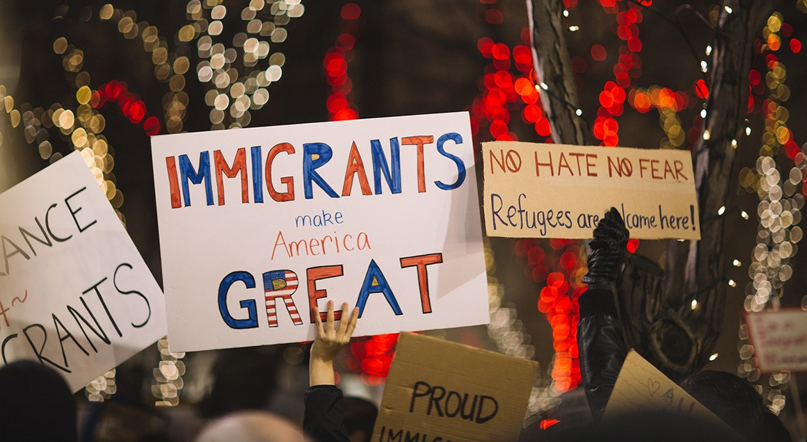 Immigrant sign protest 72px unsplash