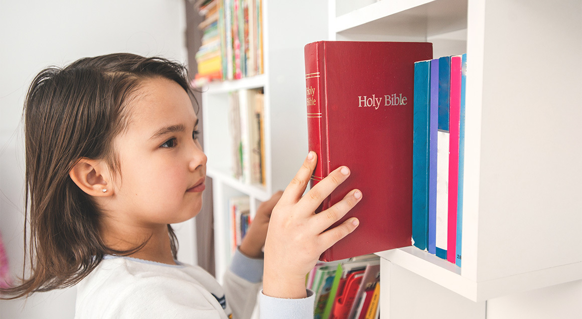 LS Girl Taking Bible From Shelf
