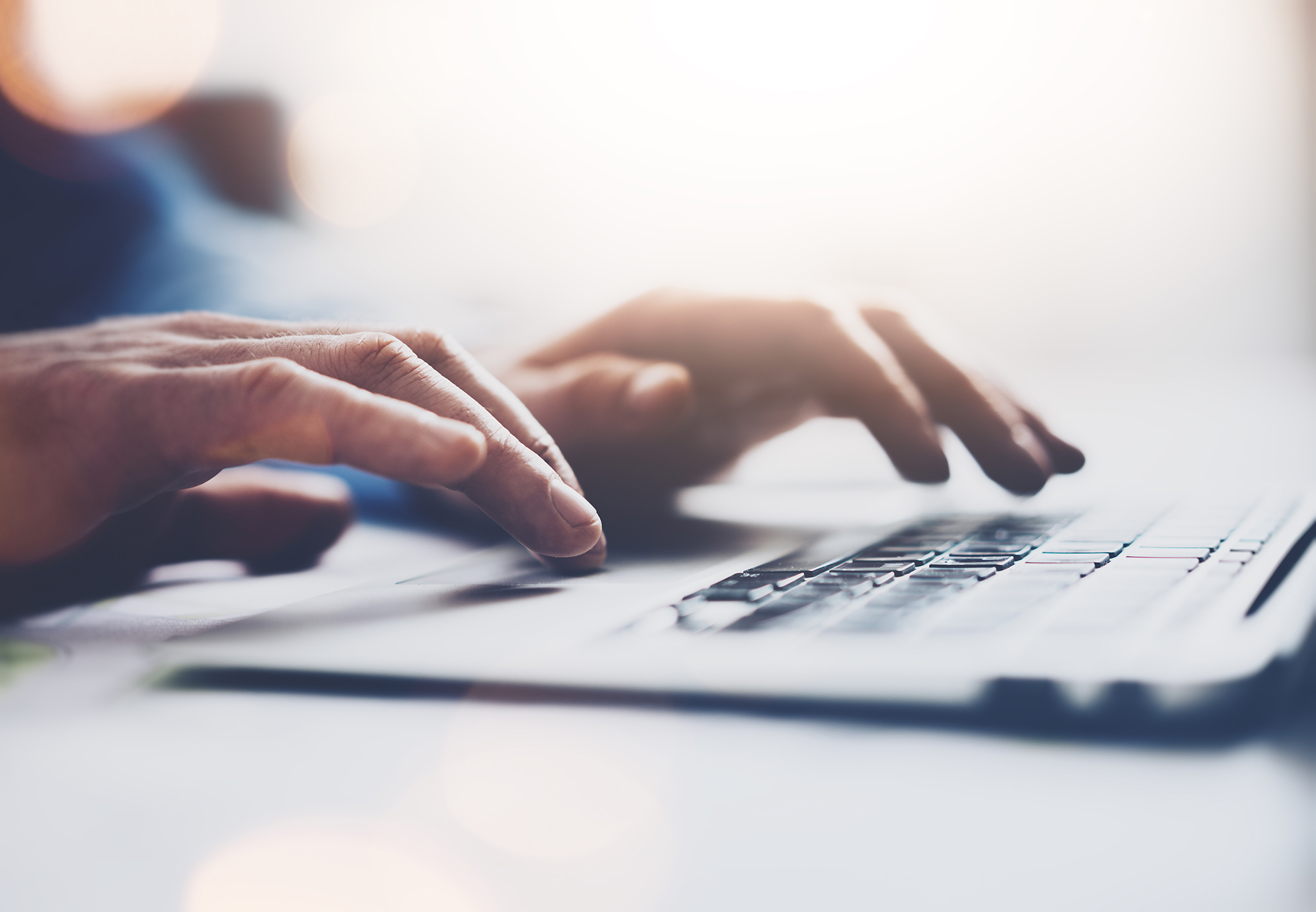 Stock hands typing on keyboard