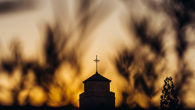 Stock sunrise over church steeple