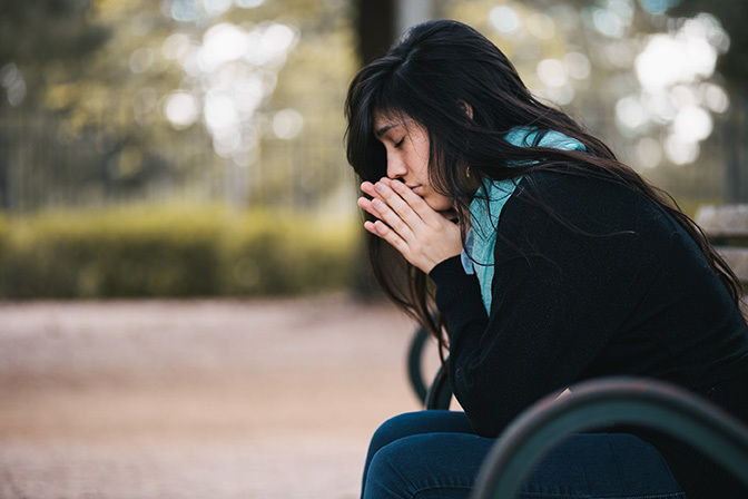 Stock woman praying alone