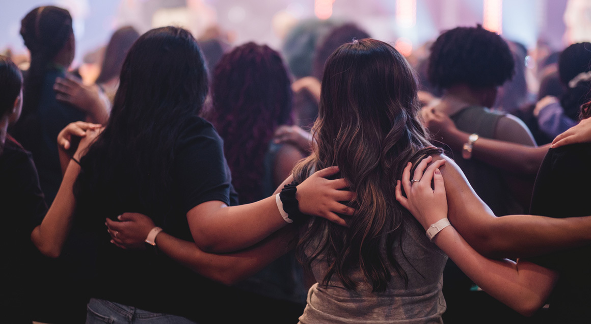 Stock women with arms on each other cropped
