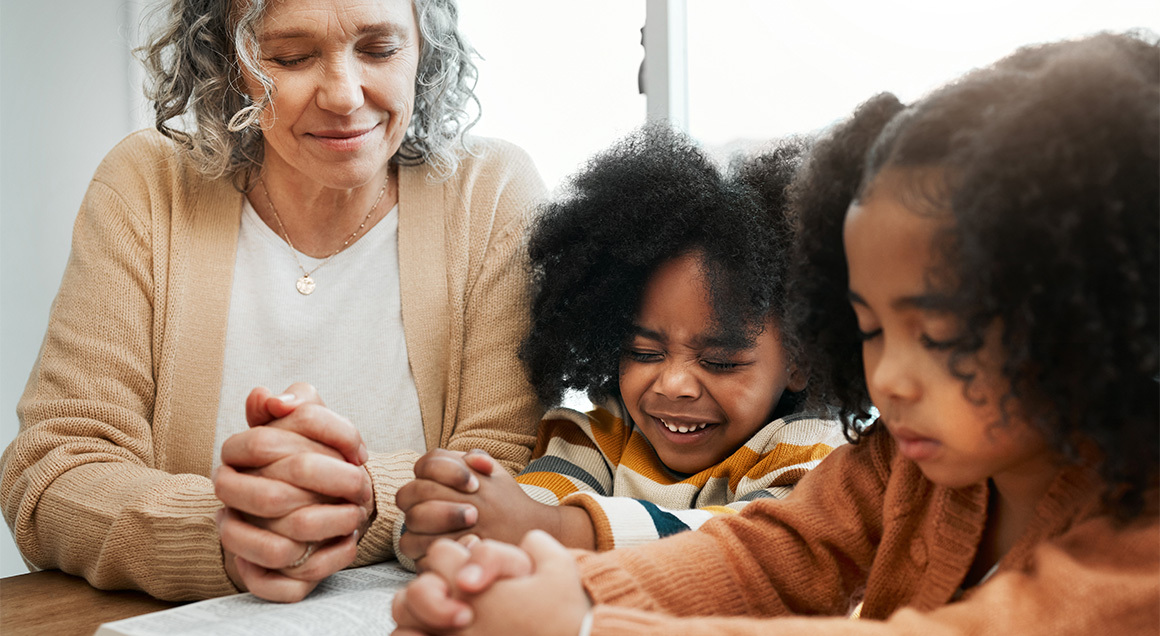 I S Grandmother Praying With Grandkids