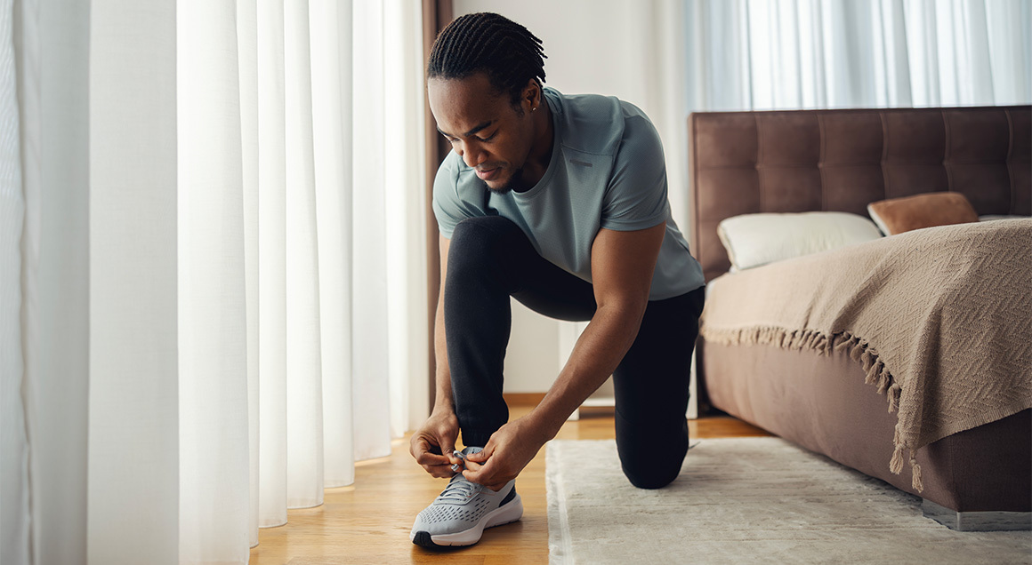 I S Man Tying Running Shoes 1