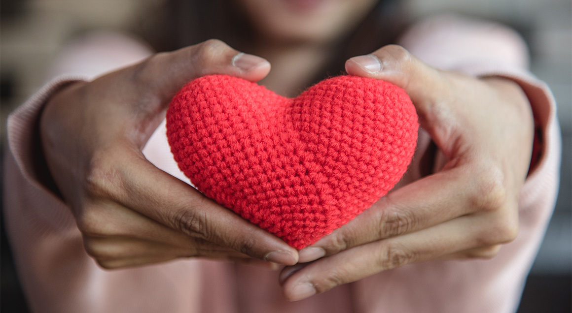 I S Woman Holding Crochet Heart